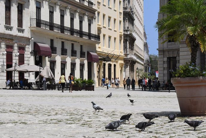 HAVANA, May 8, 2023  -- Doves forage at the historic center of the city of Havana, Cuba, May 4, 2023. The historic center of Havana was elected a world heritage site by the United Nations Educational, Scientific and Cultural Organization (UNESCO) in 198