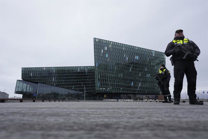 16 May 2023, Iceland, Reykjavik: Security stand outside the Harpa concert hall where a Council of Europe summit will take place in Reykjavik. Photo: Alastair Grant/PA Wire/dpa