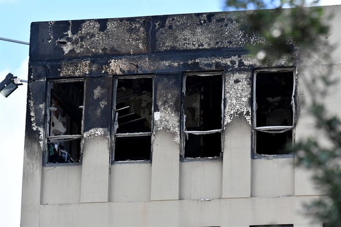 An exterior view of the Loafers Lodge after a fatal hostel fire in Wellington, NZ, Tuesday, May 16, 2023. Multiple people are believed to be dead after a "worst nightmare" fire at a 92-room hostel in New Zealand. (AAP Image/Masanori Udagawa) NO ARCHIVING