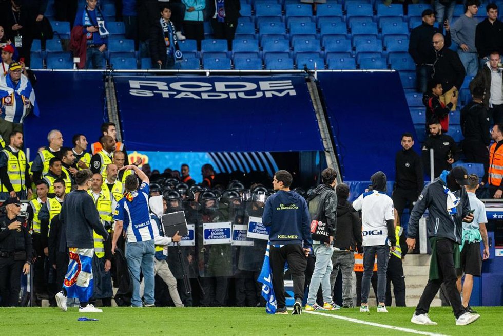 Espanyol fans invade the field and are evicted by the Mossos de Esquadra during the spanish league, La Liga Santander, football match played between RCD Espanyol and FC Barcelona  at RCD Stadium on May 14, 2023, in Barcelona, Spain.