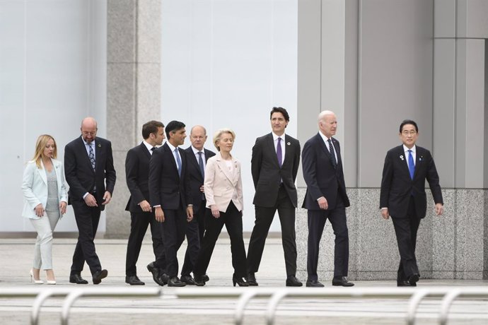 May 19, 2023, Hiroshima, Hiroshima Prefecture, Japan: Group of Seven leaders walk together after arriving to visit the Hiroshima Peace Memorial Park on the first day of the G7 Summit, May 19, 2023 in Hiroshima, Japan. Standing from left: Italian Prime M