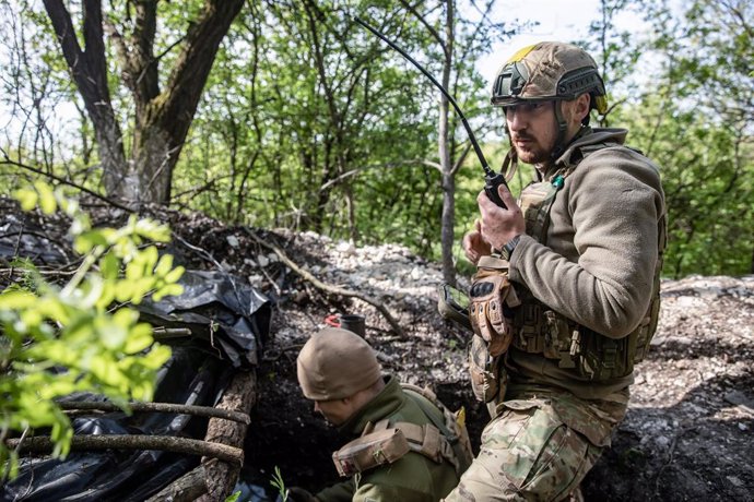 May 7, 2023, Donetsk region, Ukraine: Ukrainian army soldier receives mortar fire adjustment data over special communications in the suburbs of Bakhmut town, Donetsk region, Ukraine