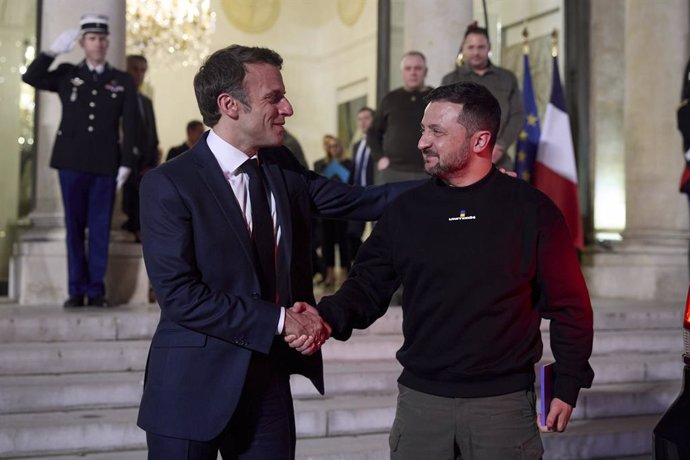 May 15, 2023, Paris, France: French President Emmanuel Macron, left, sees Ukrainian President Volodymyr Zelenskyy, right, off following meets at the Elysee Palace, May 14, 2023 in Paris, France.