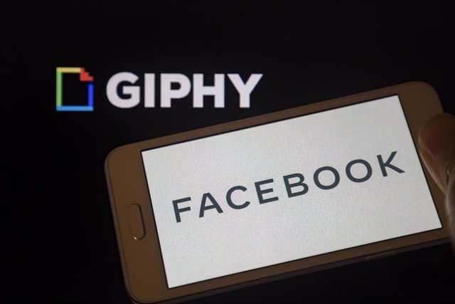 Archivo - 15 May 2020, Paraguay, Asuncion: Tthe Logo of Facebook is seen displayed on a smartphone backdropped by the Giphy logo on a screen. Social media giant Facebook said that it has bought Giphy, a popular search engine for GIFs. Photo: Andre M. Chan