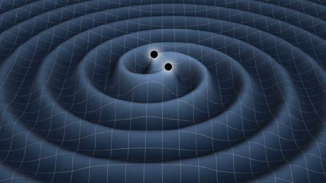 Archivo - Onda gravitacional procedente de un agujero negro binario