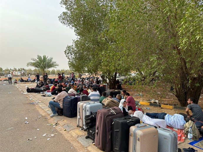OMDURMAN, April 26, 2023  -- People wait to be evacuated near an airport in Omdurman, Sudan, April 26, 2023. As conflict continues in Sudan, many people have fled to neighboring countries.