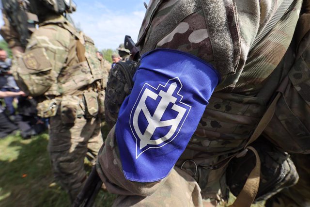 May 24, 2023, Ukraine: The logo of the Russian Volunteer Corps (RDK) is seen on the handkerchief tied around the fighter's arm during a briefing near the border in northern Ukraine.