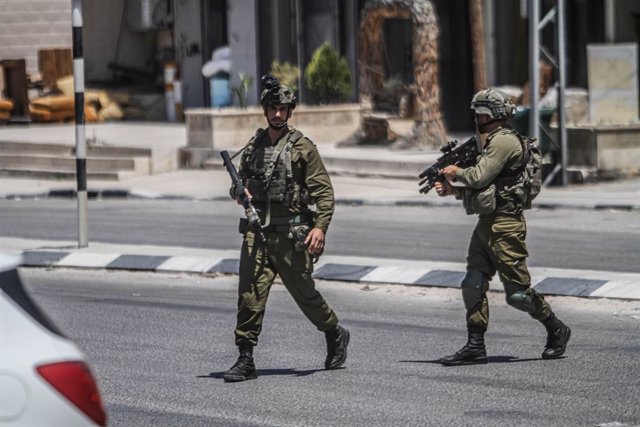 June 7, 2023, Nablus, West bank, Palestine: Armed Israeli soldiers on foot patrol in the middle of the market, in the town of Deir Sharaf, near Nablus, in the northern occupied West Bank. The Israeli army intensified its forces in the town of Hawara, wher