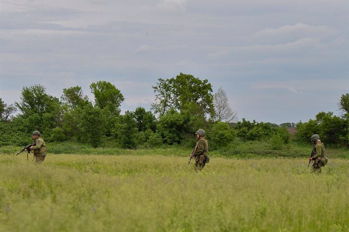 May 24, 2023, Kyiv, Donetsk Oblast, Ukraine: Soldiers with the 68th Jaeger Brigade 2nd Battalion march through the fields during live fire training outside Vuhledar. The Brigade has taken part in the battle for Vuhledar for the past months.