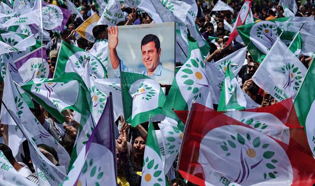 May 13, 2023, Diyarbakir, Turkey: A supporter holds the poster of Selahattin Demirtas, the former Co-Leader of the Peoples' Democratic Party (HDP), who has been held in prison in Turkey for 7 years, during the rally. The Green Left Party (YPS), supported 