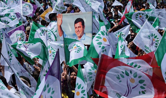 May 13, 2023, Diyarbakir, Turkey: A supporter holds the poster of Selahattin Demirtas, the former Co-Leader of the Peoples' Democratic Party (HDP), who has been held in prison in Turkey for 7 years, during the rally. The Green Left Party (YPS), supporte