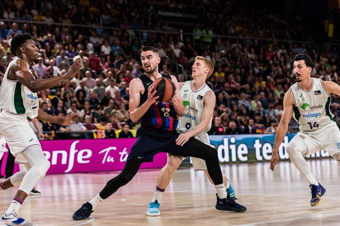 Tomas Satoransky of FC Barcelona in action against Alberto Diaz of Unicaja  during the ACB Liga Endesa Semi Finals Playoff Game 2 match between FC Barcelona and Unicaja  at Palau Blaugrana on June 09, 2023 in Barcelona, Spain.