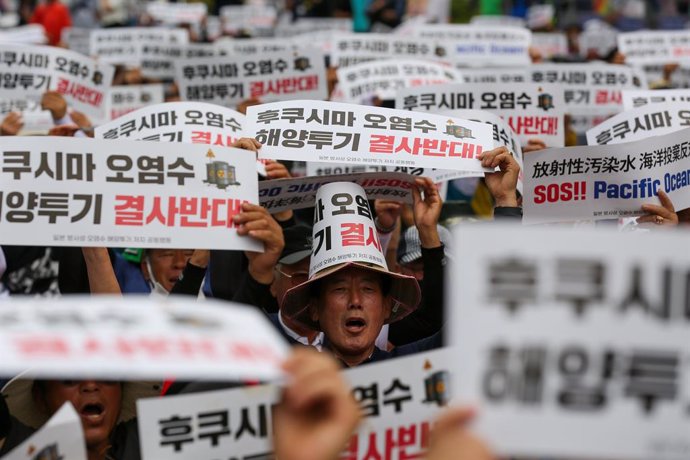 SEOUL , June 12, 2023  -- People rally to protest against Japan's planned discharge of radioactive wastewater in Seoul, South Korea, June 12, 2023. Thousands of South Korean fishermen gathered on Monday near the parliamentary building in Seoul to clamor