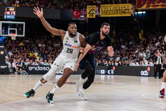 Guerschon Yabusele of Real Madrid and Nikola Mirotic of FC Barcelona  during the ACB Liga Endesa Finals Playoff Game 1 match between FC Barcelona and Real Madrid at Palau Blaugrana on June 16, 2023 in Barcelona, Spain.