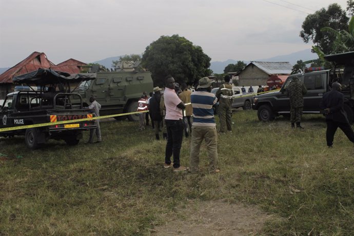 KAMPALA, June 18, 2023  -- Security officials stand near the Lhubirira Secondary School after a rebel attack, in Mpondwe, Kasese district, Uganda, June 17, 2023. A rebel attack on a secondary school in southwestern Uganda has left more than 40 people ki