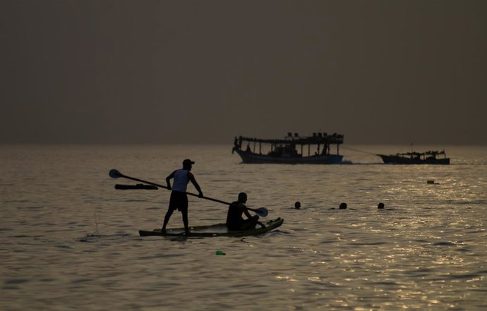 June 2, 2023: Gaza, Palestine. 02 June 2023. Palestinians swim, splash about, and sail in the Mediterranean Sea off the coast of Gaza City. The beach and the sea are one of the very few places in the narrow Gaza Strip where Palestinian families and chil