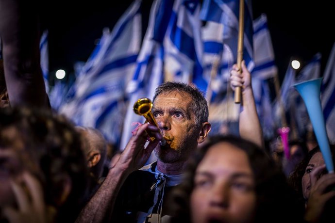 June 10, 2023, Tel Aviv, Israel: An Israeli protestor blows a horn during a rally. Tens of thousands of demonstrators have gathered in Tel Aviv and other Israeli cities to voice their opposition to the judicial overhaul plans proposed by Prime Minister 