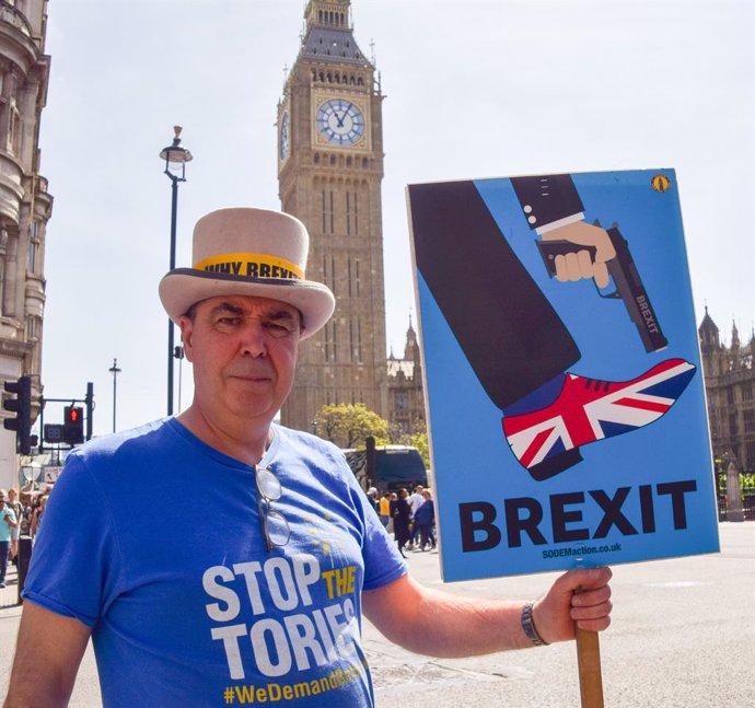 May 24, 2023, London, England, United Kingdom: Activist STEVE BRAY holds an anti-Brexit sign as anti-Tory and anti-Brexit protesters stage their weekly protest in Parliament Square.