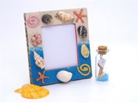 Manualidades para vacaciones en la costa: marco de fotos con conchas