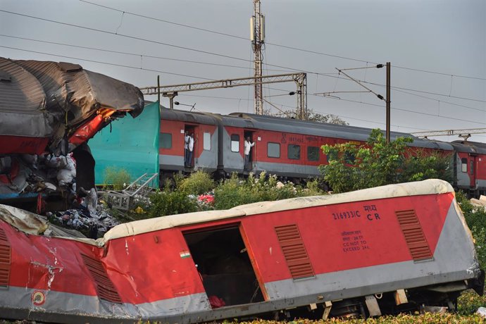 BALASORE, June 5, 2023  -- A passenger train passes by the site of a triple-train crash in Balasore district of the eastern Indian state of Odisha, June 5, 2023.   Normal rail traffic has resumed both ways at the site where the triple-train crash had oc