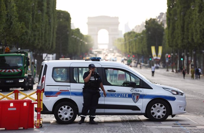 PARIS, July 3, 2023  -- A French municipal police officer is seen on duty on the famous Champs-Elysees Avenue in Paris, France, July 2, 2023. At least 719 people were arrested overnight from Saturday to Sunday in France, the fifth night of nationwide vi