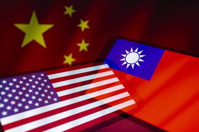 June 22, 2023, Asuncion, Paraguay: United States (US) and Taiwan flags displayed on smartphone backdropped by cropped flag of China.