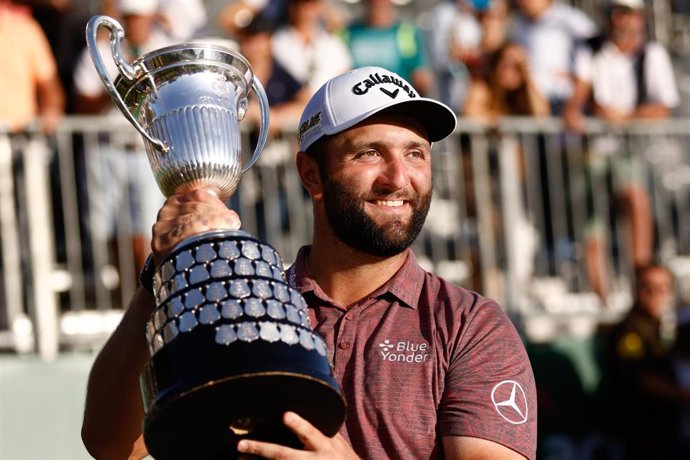 Archivo - El golfista español Jon Rahm posa con el trofeo de ganador del Acciona Open Espana de 2022 en el Club de Campo Villa de Madrid.