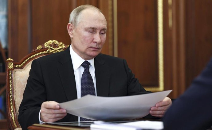 July 10, 2023, Moscow, Moscow Oblast, Russia: Russian President Vladimir Putin views a report during a face-to-face meeting with head of the Udmurt Republic Alexander Brechalov at the Kremlin, July 10, 2023 in Moscow, Russia.