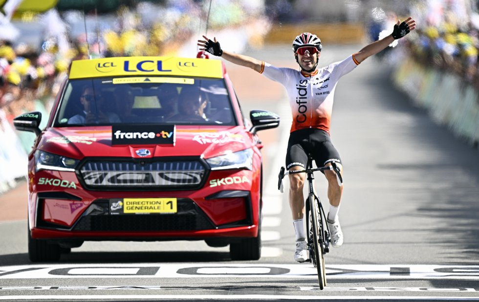 Spanish cyclist Ion Izaguirre Insausti of Cofidis celebrates as he crosses the finish line to win the 12th stage of the 110th edition of the Tour de France.