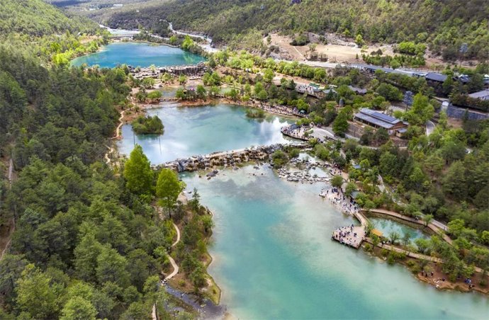 This aerial photo taken on May 17, 2023 shows the summer scenery of Lanyue (Blue Moon) Valley in Lijiang, southwest China's Yunnan Province.
