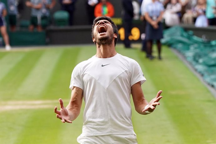 16 July 2023, United Kingdom, London: Spanish tennis player Carlos Alcaraz celebrates defeating Serbian Novak Djokovic during their men's singles final tennis match on Day Fourteen of the 2023 Wimbledon Championships at the All England Lawn Tennis and C