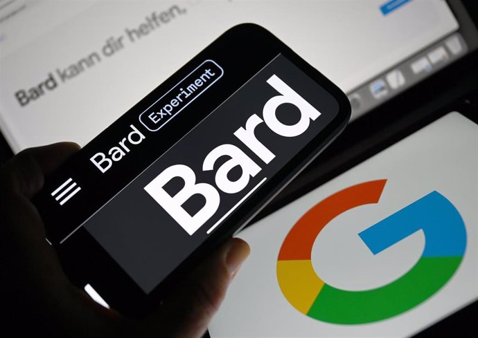 ILLUSTRATION - 13 July 2023, Hesse, Frankfurt_Main: The word "Bard" can be seen on the display of a smartphone in front of two Google logos.