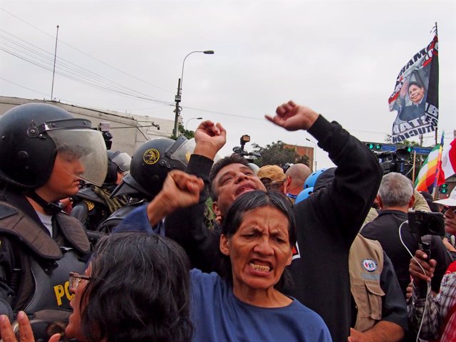 July 19, 2023, Lima, Lima, Peru: Demonstrators facing police squads when thousands of unionists, activists, and members of indigenous groups took to the streets as part of the so called Third Takeover of Lima, to start another wave of protests against the
