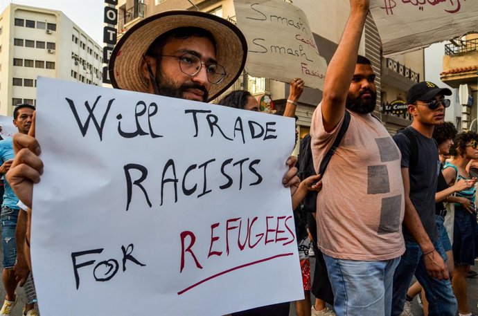 July 14, 2023: Tunis, Tunisia. 14 July 2023. Demonstrators raise banners against fascism and racism while chanting anti-racism slogans during a protest in solidarity with migrants in Tunis. Tunisia rights groups have called for emergency aid and shelter