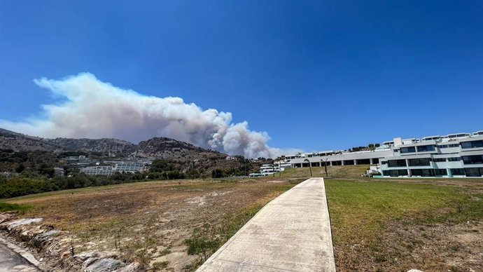 July 22, 2023, Lindos, Lindos, Greece: Smoke from Wildfire's looms over the holiday island of Rhodes as Wildfire's reignite due to strong winds views from Viglika Beach, Near Lindos, Greece, 22nd July 2023.