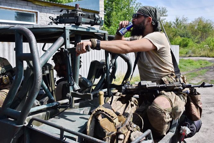 July 19, 2023, Tavriiske, Zaporizhzhia, Ukraine: Ukrainian army soldier seen drinking soda water as they drive towards the frontline on a combat buggy in Tavriiske. Ukrainian armed forces are using buggy-type vehicles sporting roof-mounted anti-tank gui