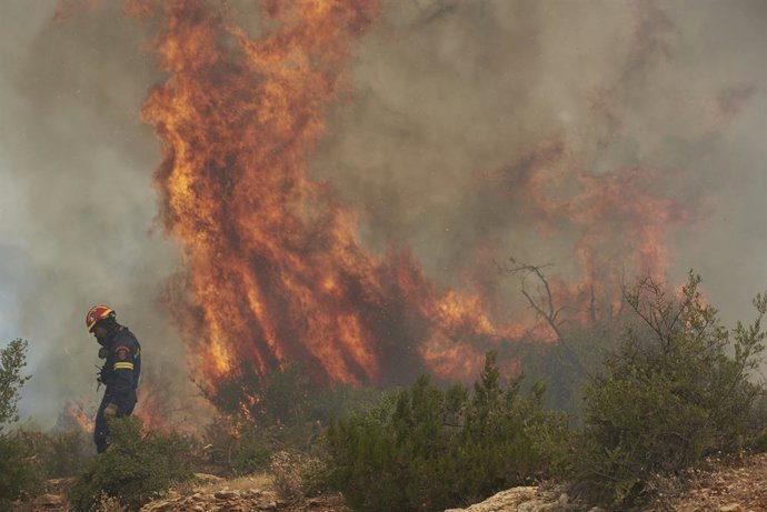 July 18, 2023, Viotia, Greece: Firefighters try to contain a wildfire burning for a second consecutive day. The fire erupted in the Dervenochoria Viotia area some 50 kilometers near Athens.