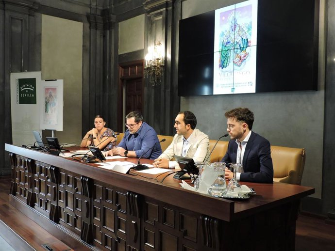 Presentación en la Casa de la Provincia del cartel y el programa de actividades de la romería y actividades para las fiestas de Peñaflor, en Sevilla.