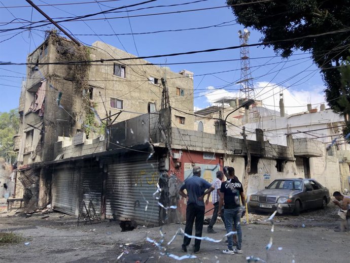 SIDON (LEBANON), Aug. 1, 2023  -- Palestinians inspect the damage to their properties in the Ain al-Helweh refugee camp near Sidon, southern Lebanon, on Aug. 1, 2023. Clashes erupted again on Tuesday in the refugee camp, hosting largely Palestinians, de