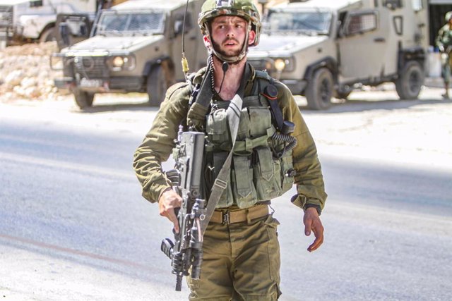 August 2, 2023, Jordan Valley, West Bank, Palestine: An Israeli soldier secures the area around the house, which continues to be surrounded by an Israeli army force where the perpetrator of a shooting attack was suspected to be, next to the site where the