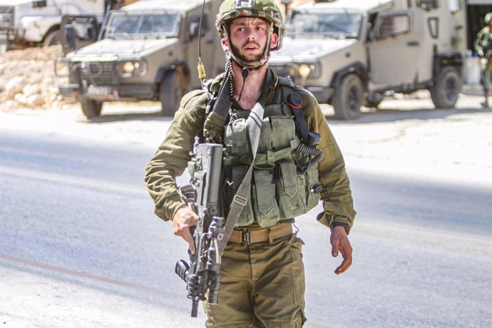 August 2, 2023, Jordan Valley, West Bank, Palestine: An Israeli soldier secures the area around the house, which continues to be surrounded by an Israeli army force where the perpetrator of a shooting attack was suspected to be, next to the site where t