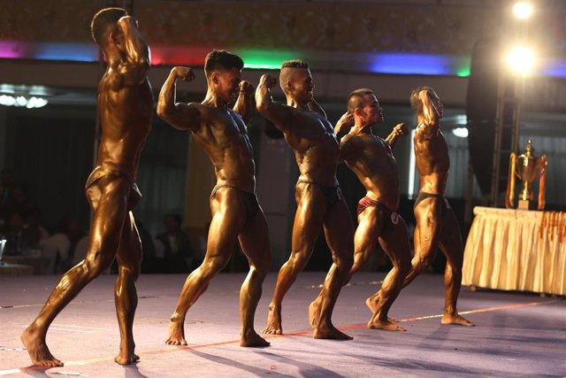 Contestants compete during the Region and State Bodybuilding and Physique Sports Competition in Yangon, Myanmar, July 23, 2023.