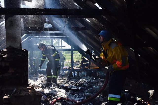 July 13, 2023, Verkhnya Tersa, Ukraine: Ukrainian State Emergency Service firefighters put out the fire after a Russian shelling hit a private house in the village Verkhnya Tersa. On the 505th day of the full-scale Russian war against Ukraine, heavy fight