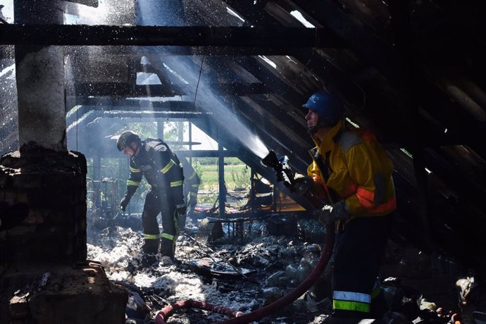 July 13, 2023, Verkhnya Tersa, Ukraine: Ukrainian State Emergency Service firefighters put out the fire after a Russian shelling hit a private house in the village Verkhnya Tersa. On the 505th day of the full-scale Russian war against Ukraine, heavy fig