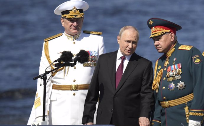 July 30, 2023, St Petersburg, Leningrad Oblast, Russia: Russian President Vladimir Putin, center, reviews the parade of naval vessels accompanied by Russian Defence Minister Sergei Shoigu, right, and Naval Commander Nikolai Yevmenov, left, onboard the n