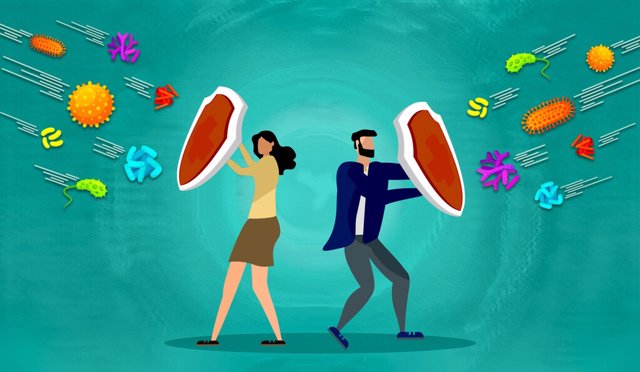 Archivo - Ilustración en la que un hombre y una mujer se protegen con un escudo frente a virus y bacterias.