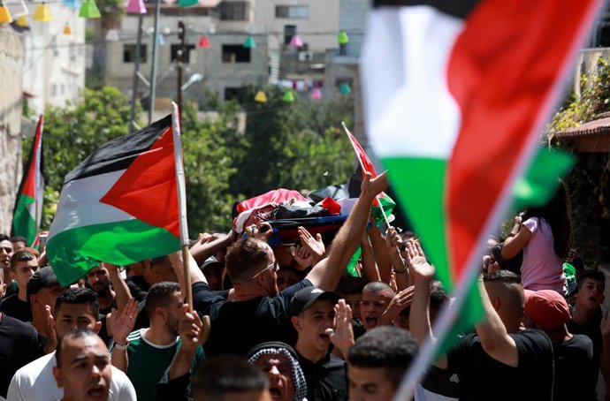 TULKAREM, Aug. 4, 2023  -- Mourners carry the body of Mahmoud Abu Sa'an during his funeral in the West Bank city of Tulkarem, on Aug. 4, 2023. Two Palestinians were killed on Friday during clashes with Israelis in two separate incidents in the West Bank