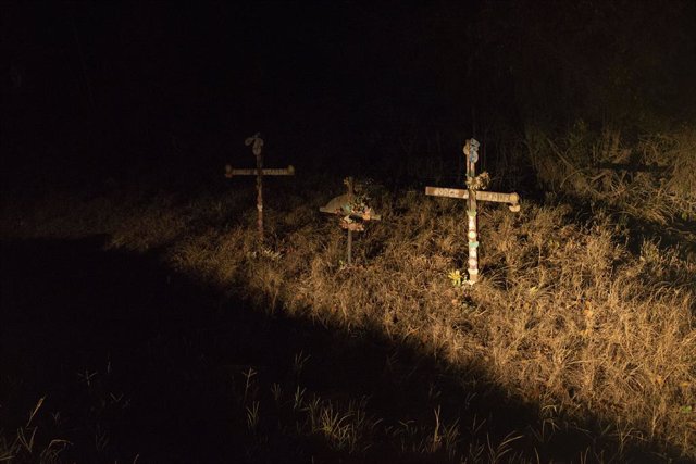 Archivo - May 8, 2019 - San Pedro Sula, Cortés, Honduras - Crosses in a ditch marking the location where three dead bodies were found. There are approximately three hundred people fleeing the country and problems range from rampant political corruption to