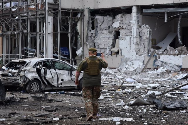 August 11, 2023, Zaporizhzhia, Ukraine: A Ukrainian army soldier takes a photo of the 'Reikartz' hotel heavily damaged following Russian rocket attack in Zaporizhia. A Russian missile struck a hotel in the Ukrainian city of Zaporizhzhia on August 10. One 