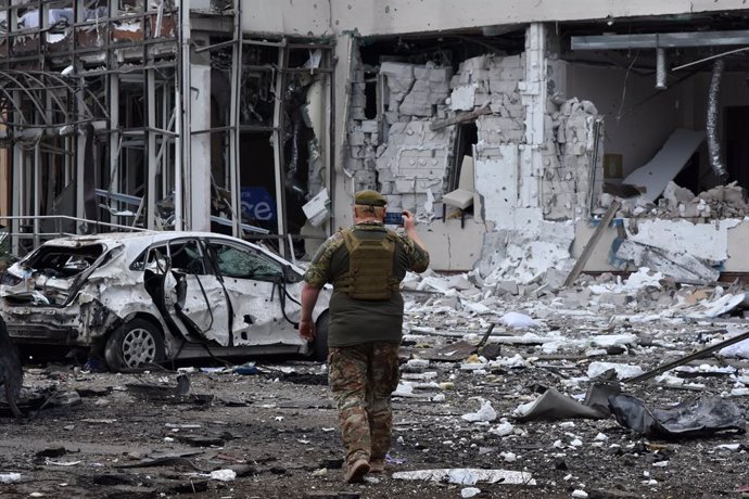 August 11, 2023, Zaporizhzhia, Ukraine: A Ukrainian army soldier takes a photo of the 'Reikartz' hotel heavily damaged following Russian rocket attack in Zaporizhia. A Russian missile struck a hotel in the Ukrainian city of Zaporizhzhia on August 10. On